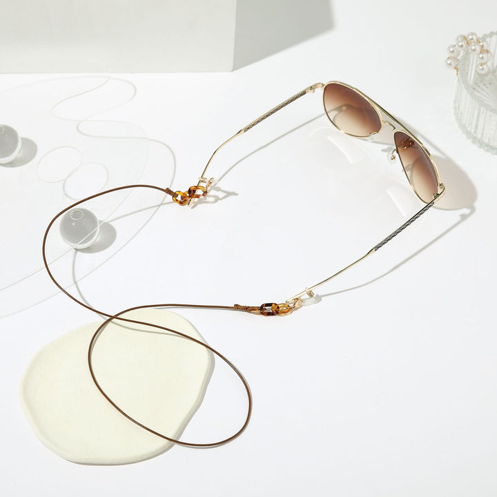 Hands-free eyeglass holder chain. Stylish lanyard keeps glasses secure & accessible. Unisex design.