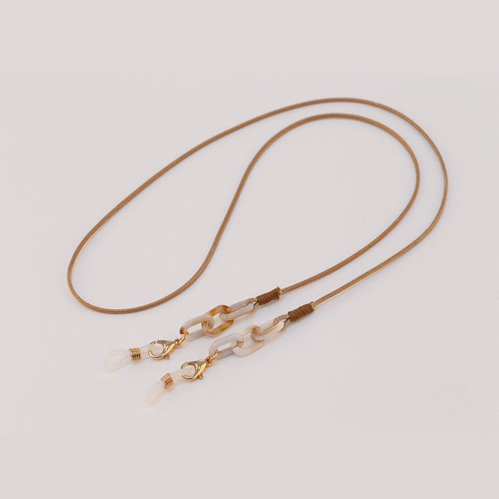 Close-up: Durable metal eyeglass chain. Multifunctional glasses holder. Stylish eyewear accessory lanyard.