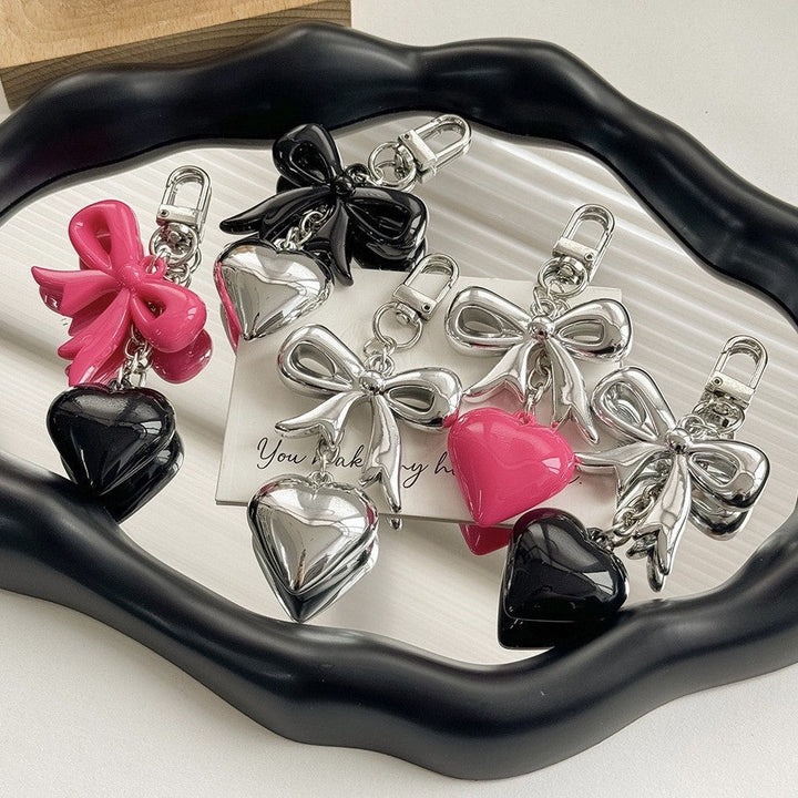 Stylish purple heart charm keychain for women, a durable bag accessory and fashion statement.