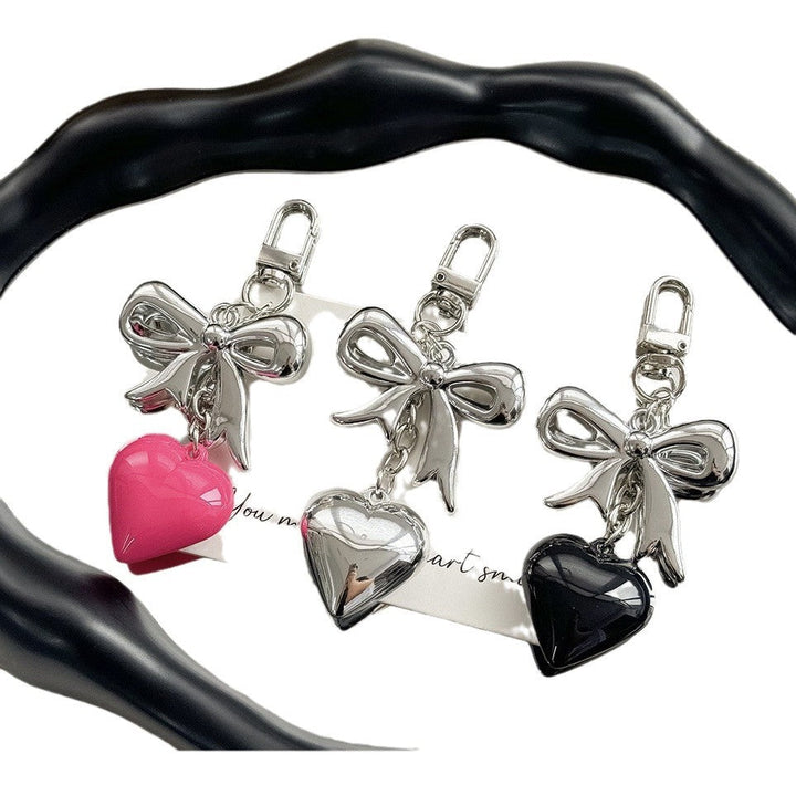 Heart-shaped purple keychain, a chic and durable accessory for women's handbags and keys.