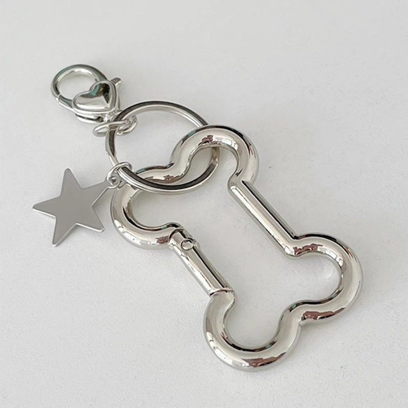 Stylish silver star pendant keychain, a chic unisex bag charm accessory.