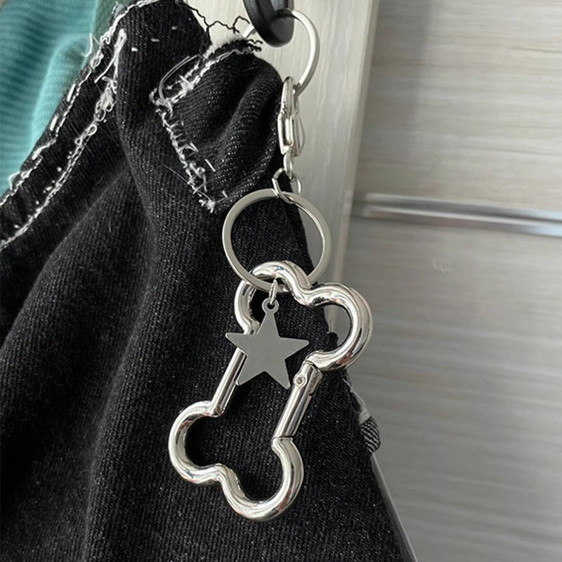 Elegant metal star key charm for bags & keys. A versatile and modern accessory.