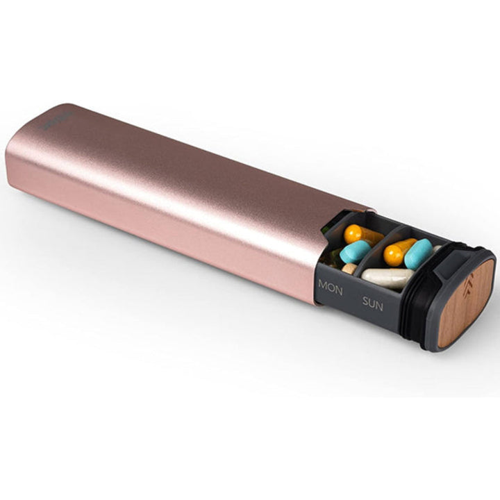 Modern aluminum and wood pill dispenser, a stylish 7-day organizer for seamless weekly health routine.