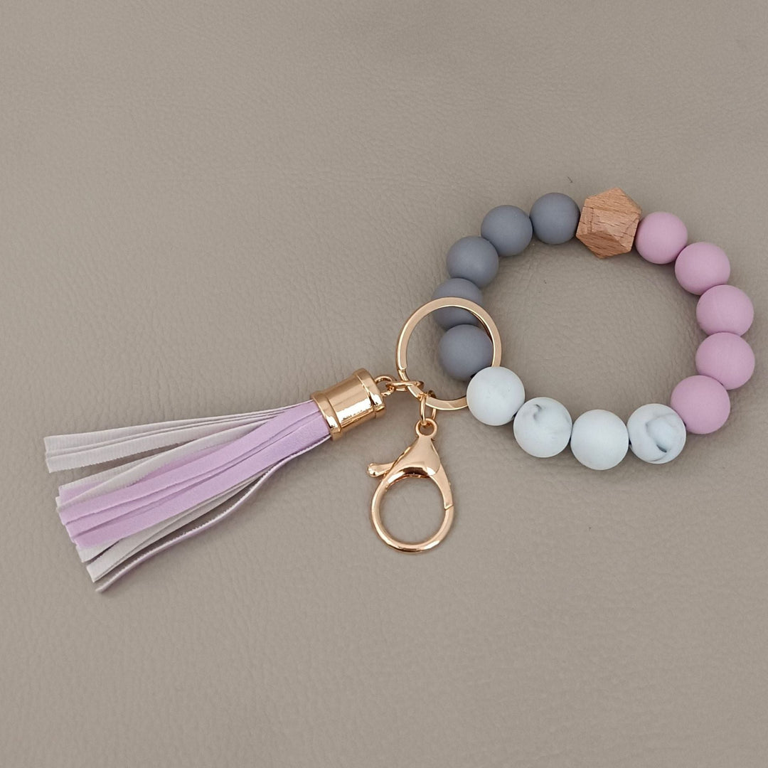 Assorted colors of chic beaded keychain bracelets, stylish unisex silicone accessories and gifts.