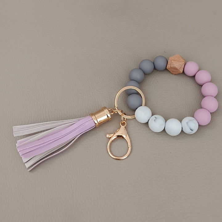 Assorted colors of chic beaded keychain bracelets, stylish unisex silicone accessories and gifts.