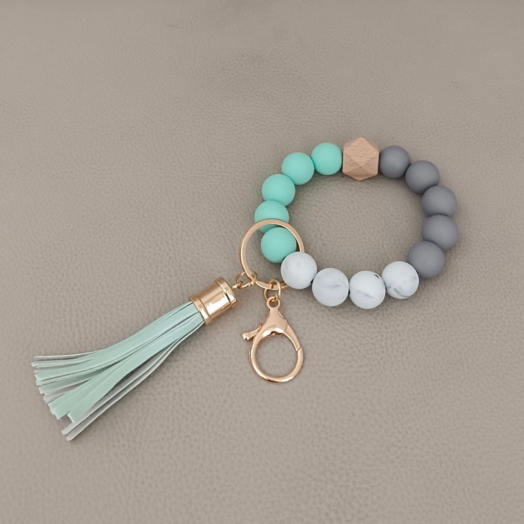 Unique design: chic beaded keychain bracelet with silicone ring, a unisex style statement.