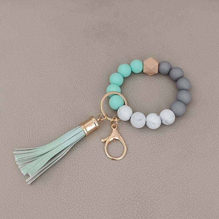 Unique design: chic beaded keychain bracelet with silicone ring, a unisex style statement.