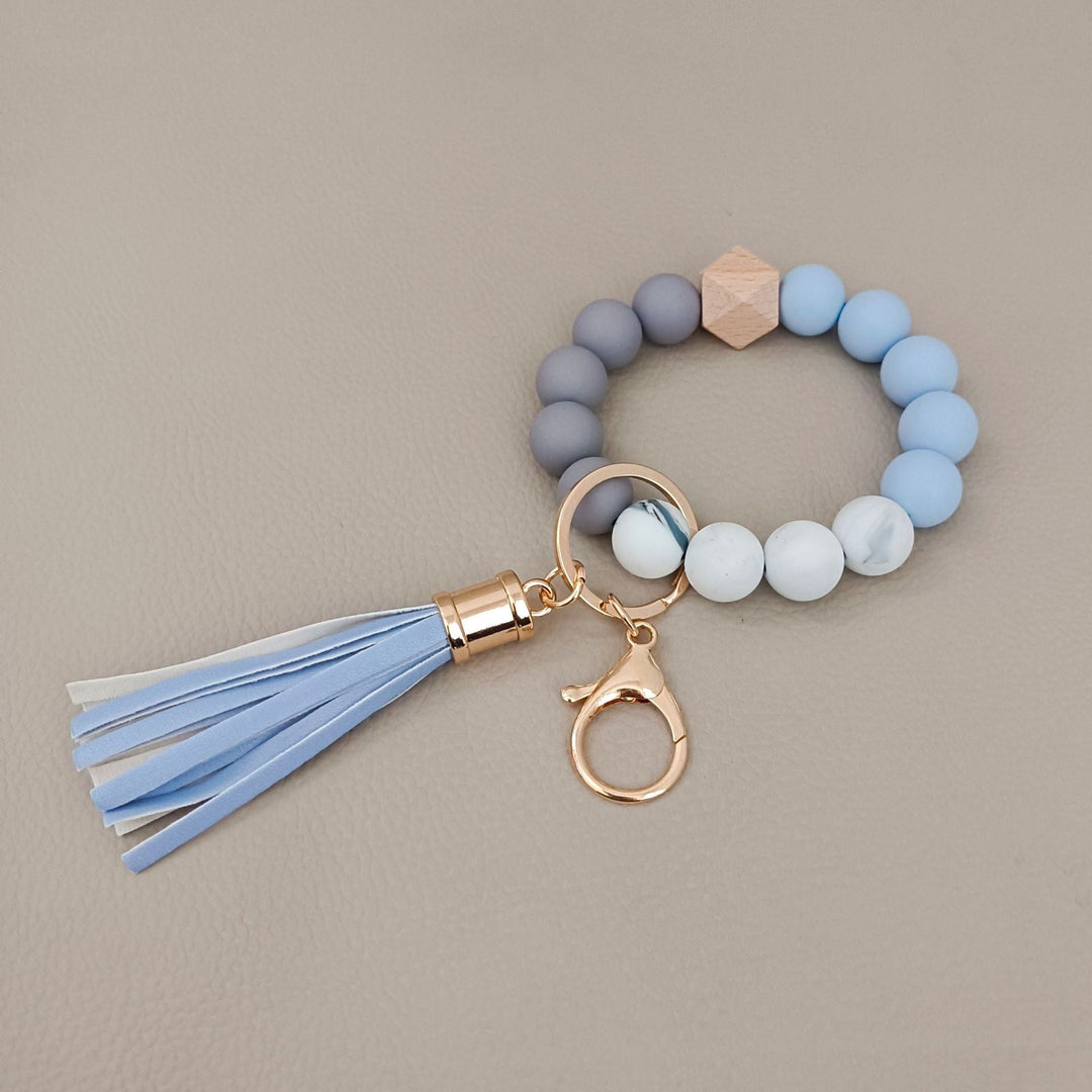 Modern aesthetic: unisex beaded keychain bracelet with sleek silicone and colorful beads.