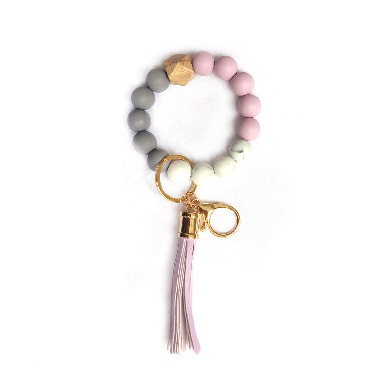 Elegant beaded silicone keychain bracelet, a versatile unisex fashion accessory for keys and bags.