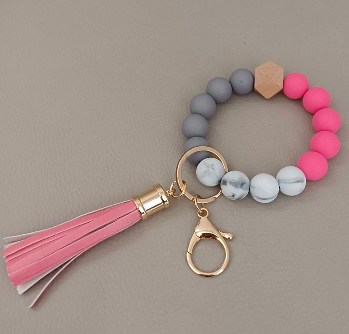 Trendy unisex beaded keychain bracelet, a modern accessory for keys, bags, or personal style.