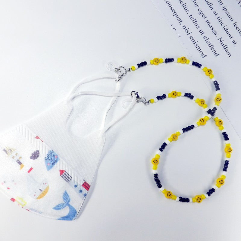 Fashionable beaded mask chain, a practical and hygienic accessory for convenient mask wearing.