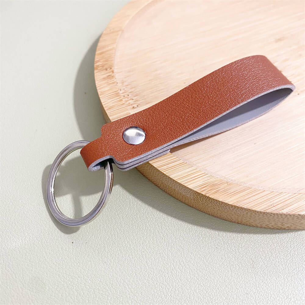 Premium leather key holder with sturdy metal ring, ensuring secure key organization. Elegant & practical.