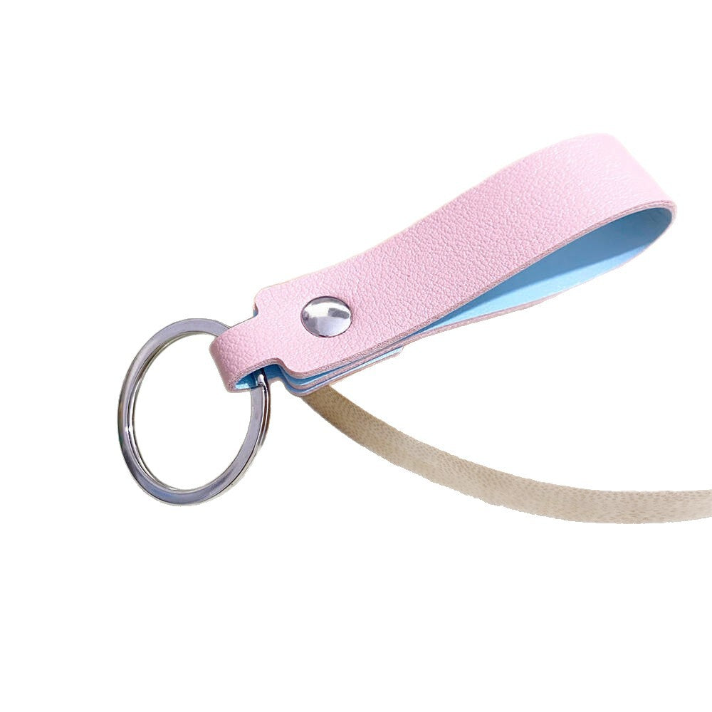 Close-up of a high-quality unisex leather keyring, showcasing fine stitching and durable hardware.