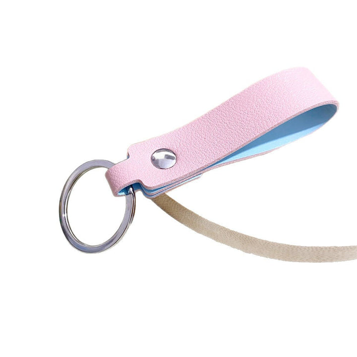 Close-up of a high-quality unisex leather keyring, showcasing fine stitching and durable hardware.