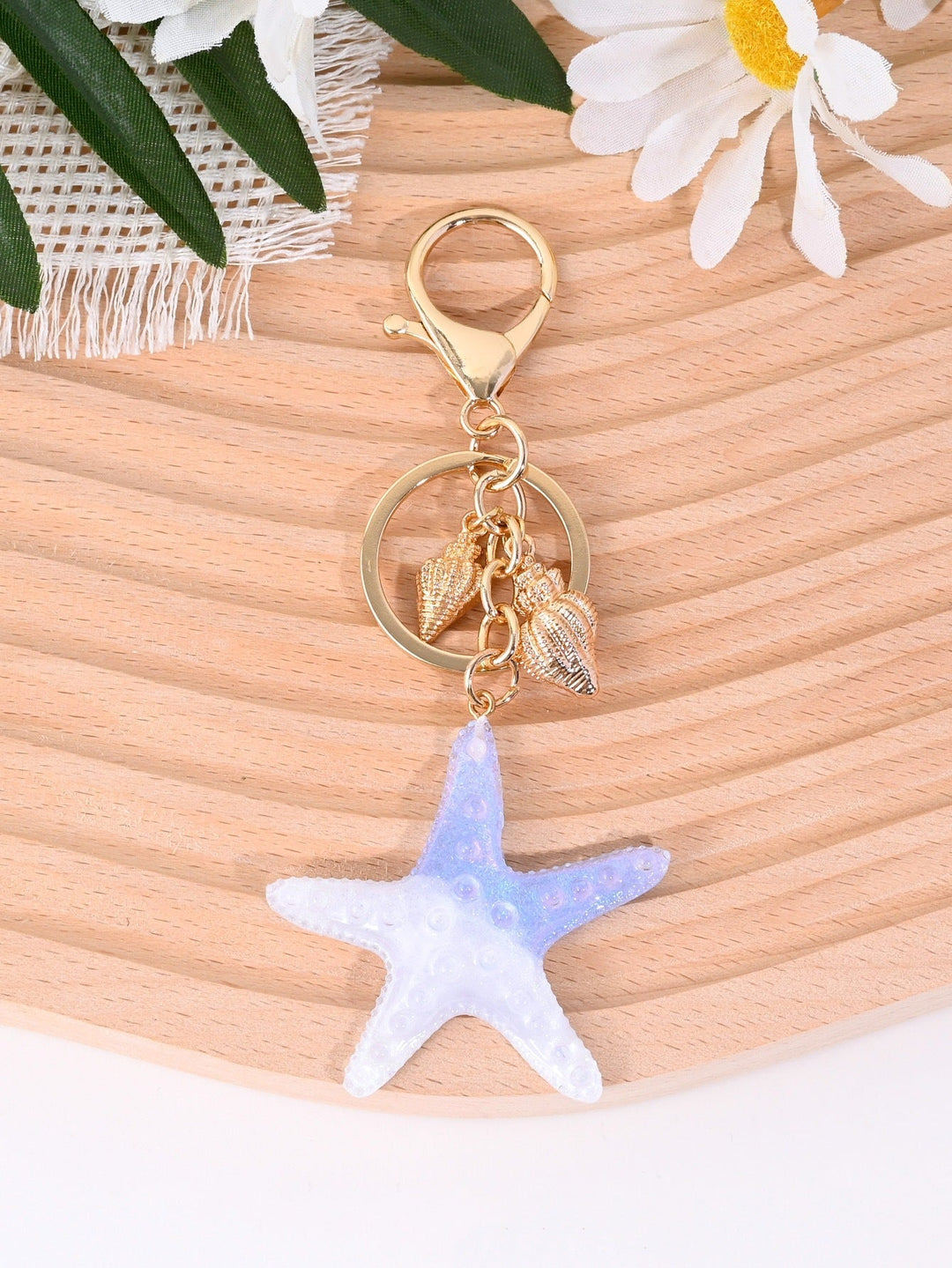 Premium nautical star key holder; durable metal, stylish unisex bag charm.