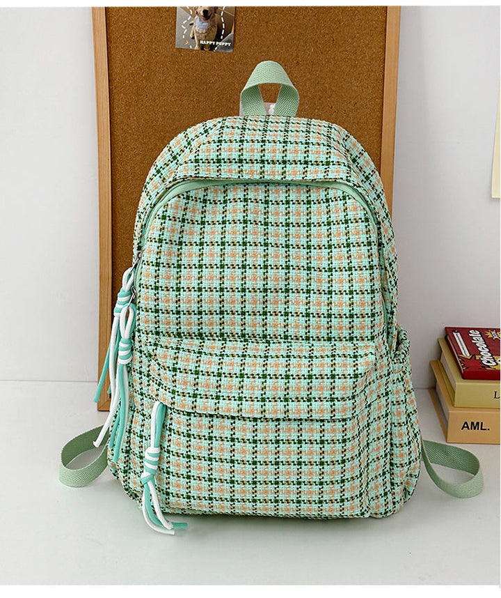 Functional unisex plaid patterned school backpack with spacious compartments for daily essentials.
