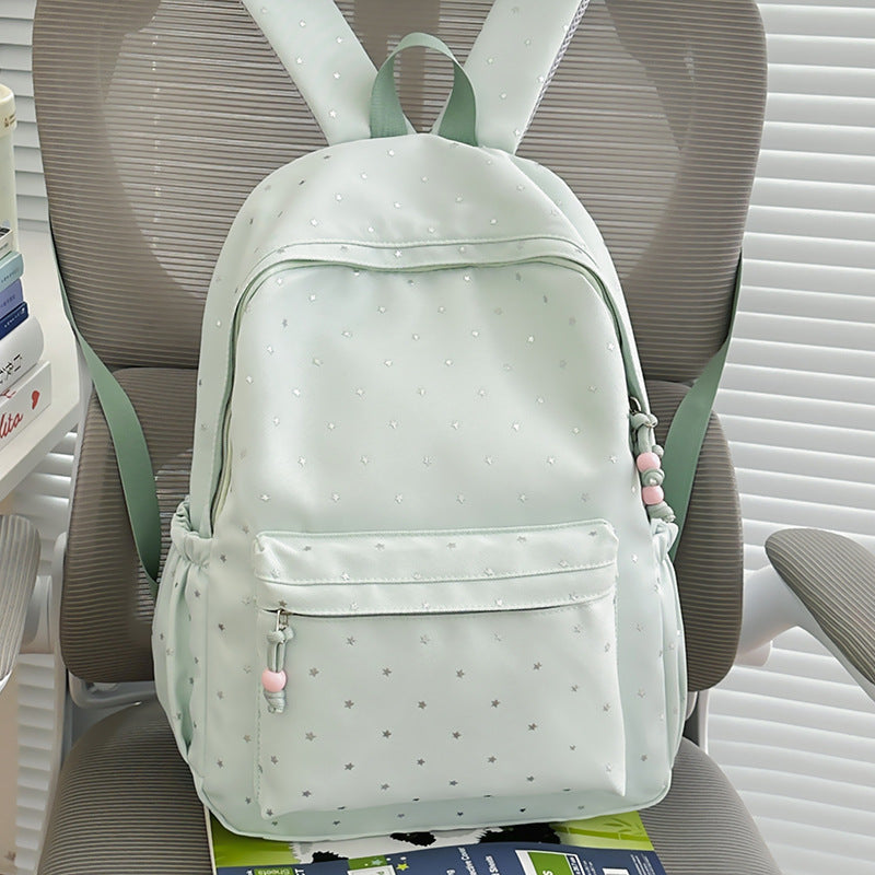 Close-up of the stylish star print design on the unisex everyday backpack. Modern and eye-catching.