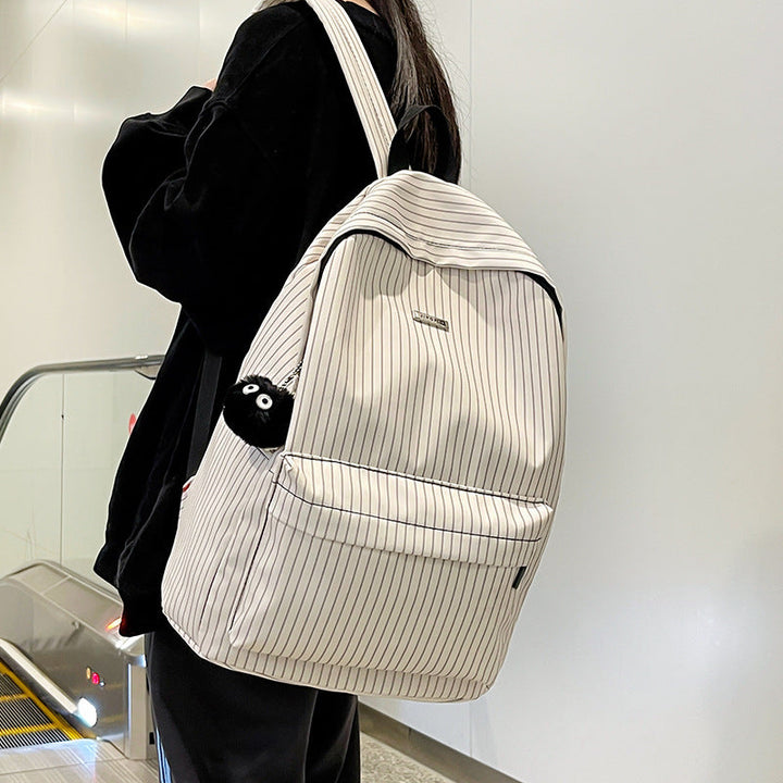 Durable, stylish striped unisex backpack with multiple compartments for organization & comfortable wear.