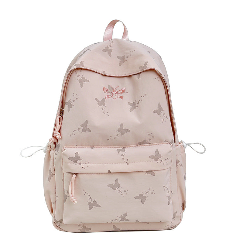 Stylish women's backpack with vibrant butterfly print, perfect for fashion-conscious everyday use or casual outings.