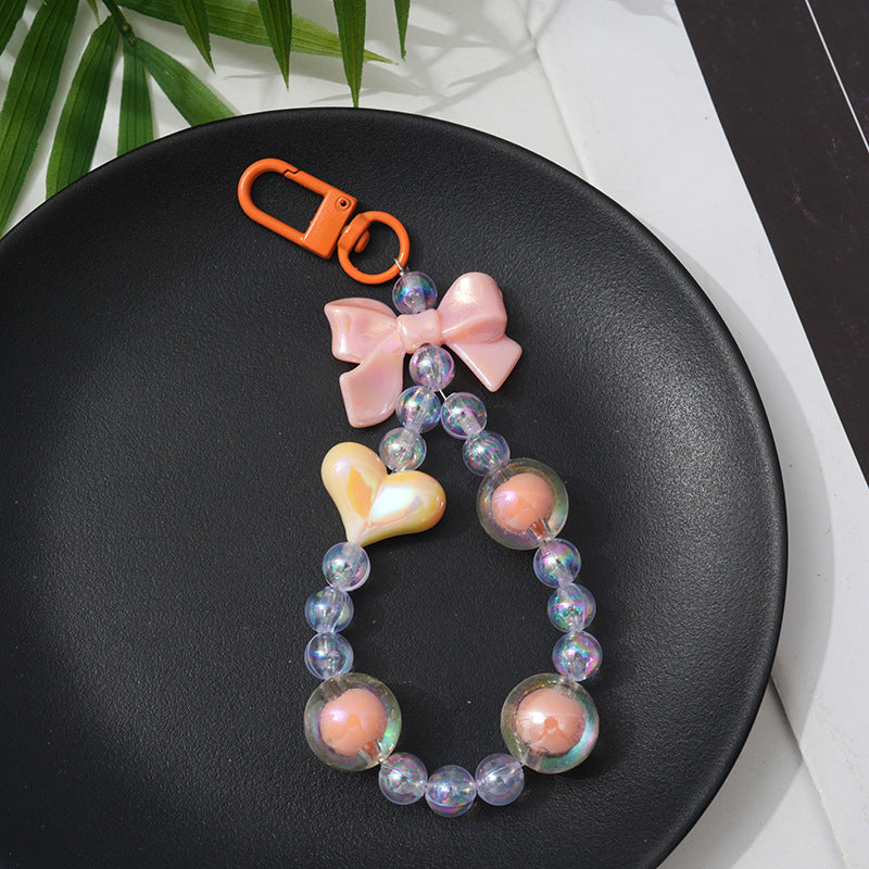 Decorative beaded keychain, an ideal gift for her, featuring colorful charms for a stylish bag or purse accessory.