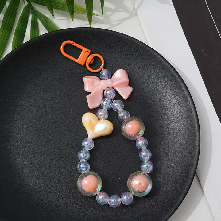 Decorative beaded keychain, an ideal gift for her, featuring colorful charms for a stylish bag or purse accessory.
