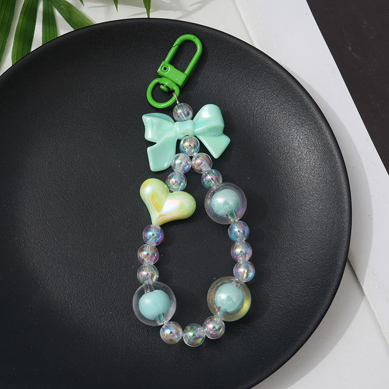 Brightly colored beaded charm keychain with intricate details, a stylish women's accessory for bags and keys.