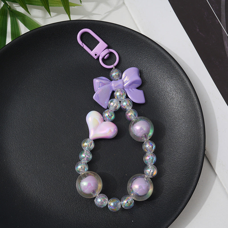 Elegant women's charm keychain, crafted with multi-colored beads, perfect as a decorative bag accessory or thoughtful gift.