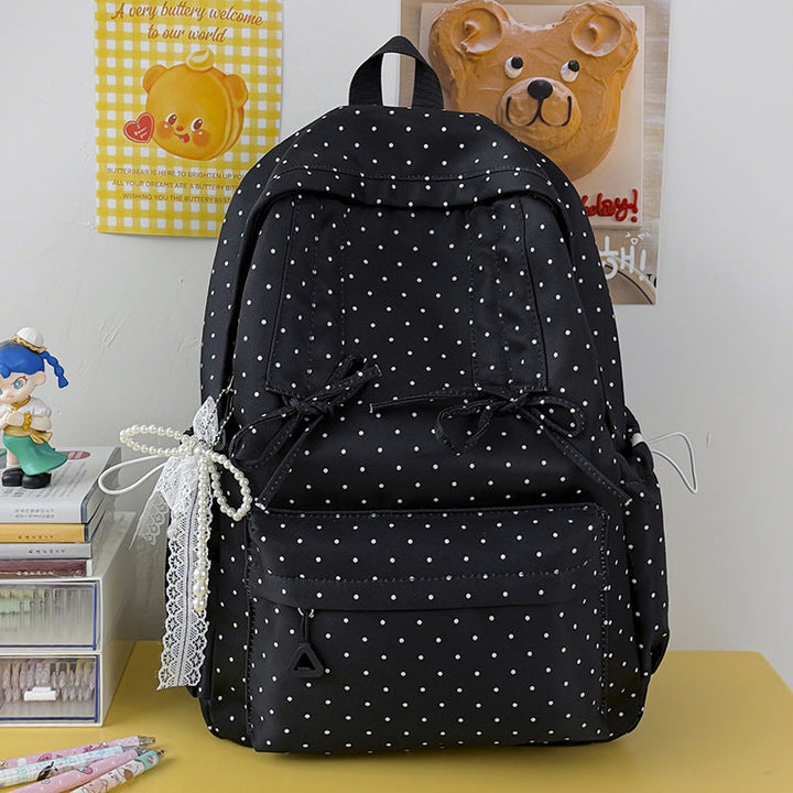 Cute fashion polka dot women's backpack, ideal for casual wear, travel, or a stylish school bag.
