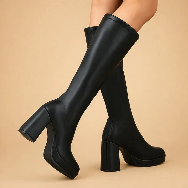 Descriptive image of women's black platform over-the-knee boots with a sturdy chunky heel.