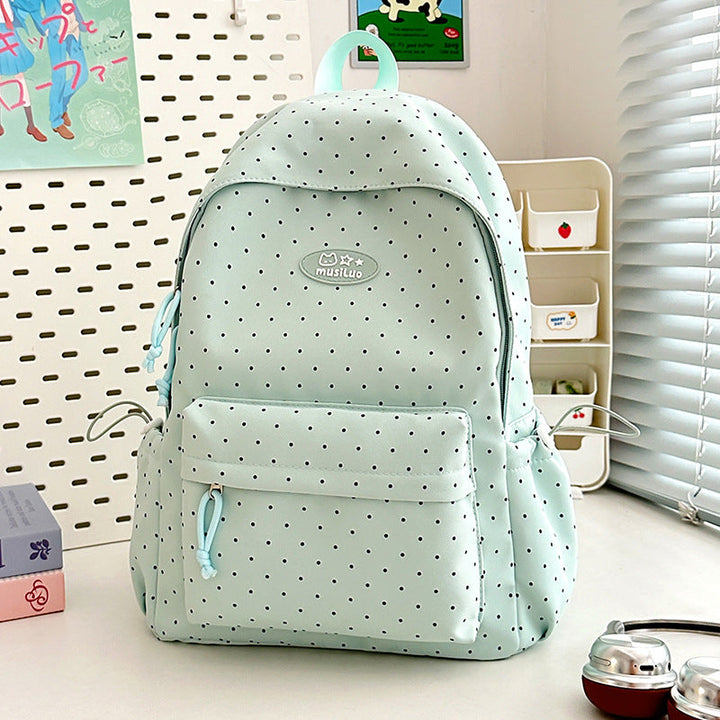 Stylish women's black polka dot backpack, perfect for daily use, school, or work. Organized & durable fashion accessory.