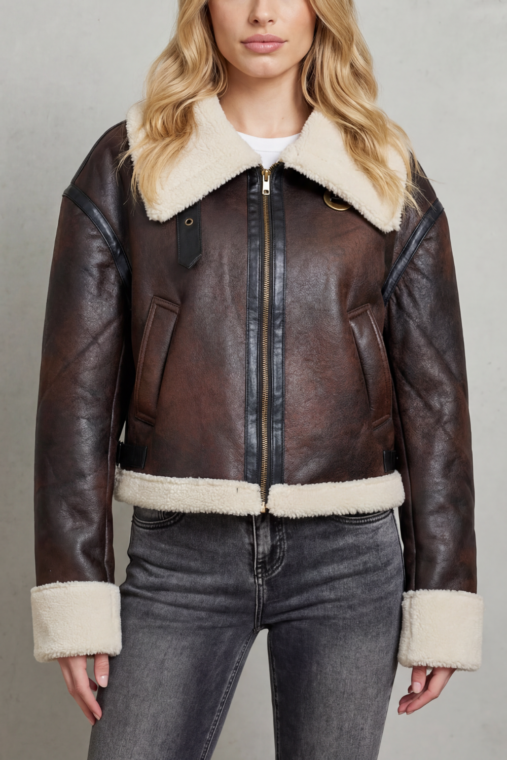 Stylish women's brown cropped aviator jacket with a luxe collar, perfect for versatile autumn & winter fashion.