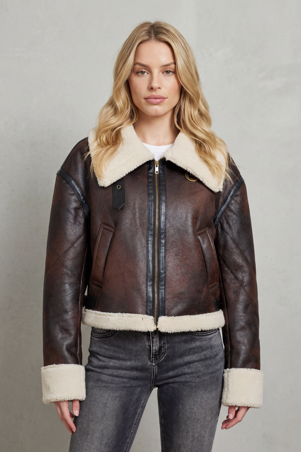 Cozy women's cropped aviator jacket in rich brown, featuring a luxurious collar and stylish design for outerwear.