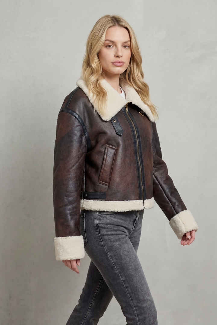 Fashionable women's cropped brown aviator jacket with luxe collar, a versatile outerwear piece for stylish comfort.