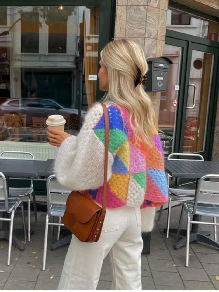 Stylish women's color-block cropped sweater, perfect for fall fashion. Comfortable knit, long sleeve design.