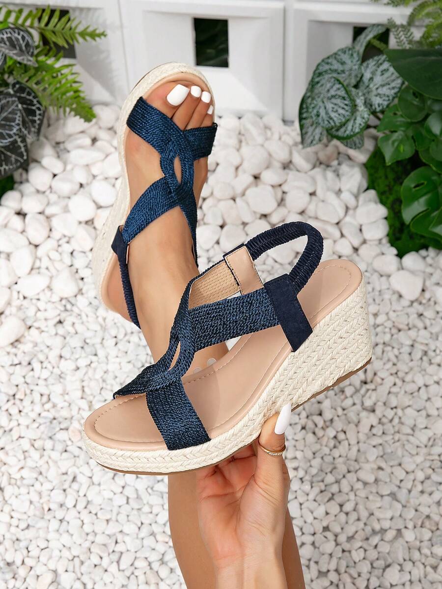 Comfortable open-toe criss-cross platform wedge sandals for women, perfect for elegant summer fashion.