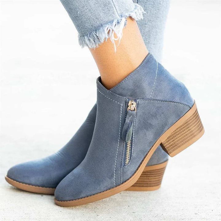 Elegant women's ankle boots with a convenient side zipper, ideal for casual and stylish fall/winter outfits.