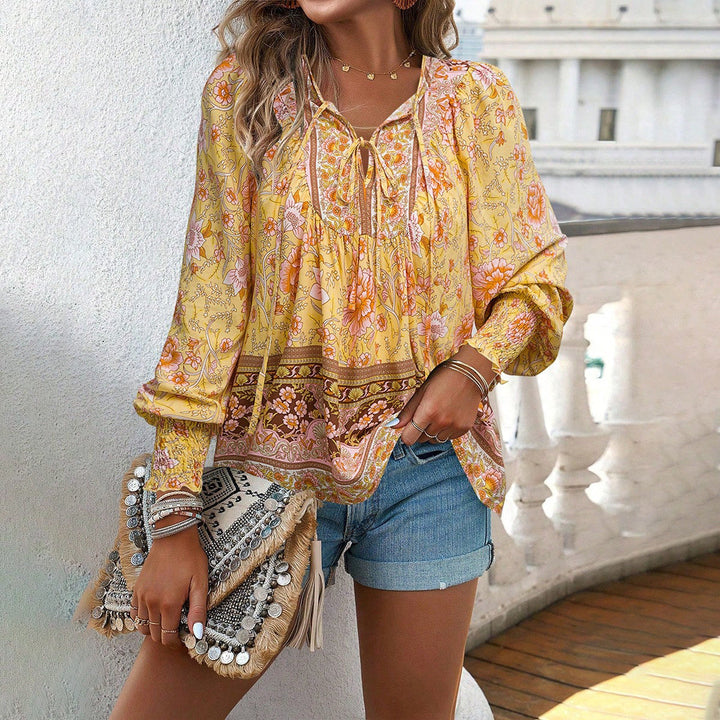 Vibrant floral print long-sleeve tie-front blouse for women. Ideal lightweight spring & summer top, casual yet chic.