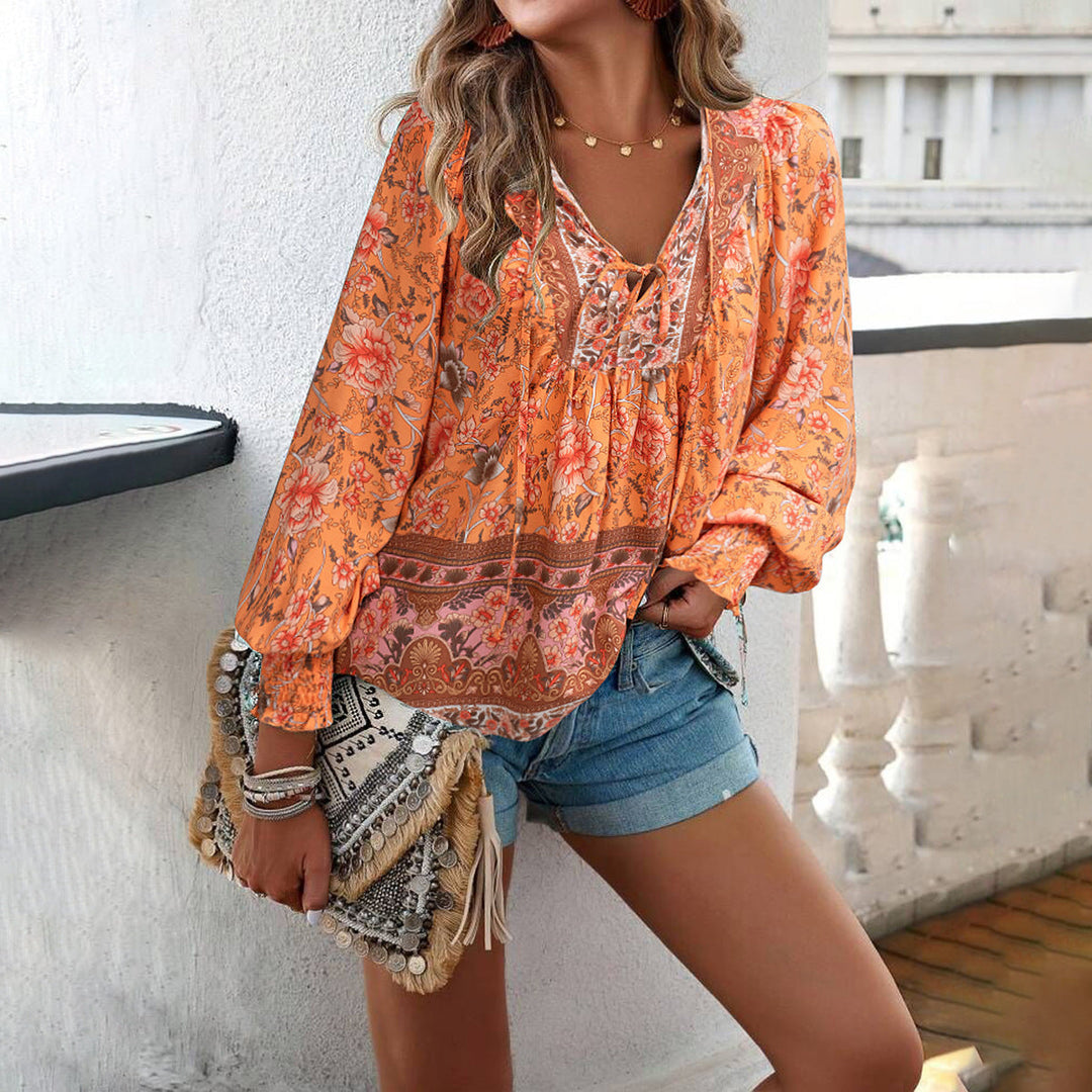 Lightweight women's floral long-sleeve top with tie front. Comfortable & stylish spring/summer blouse for everyday wear.