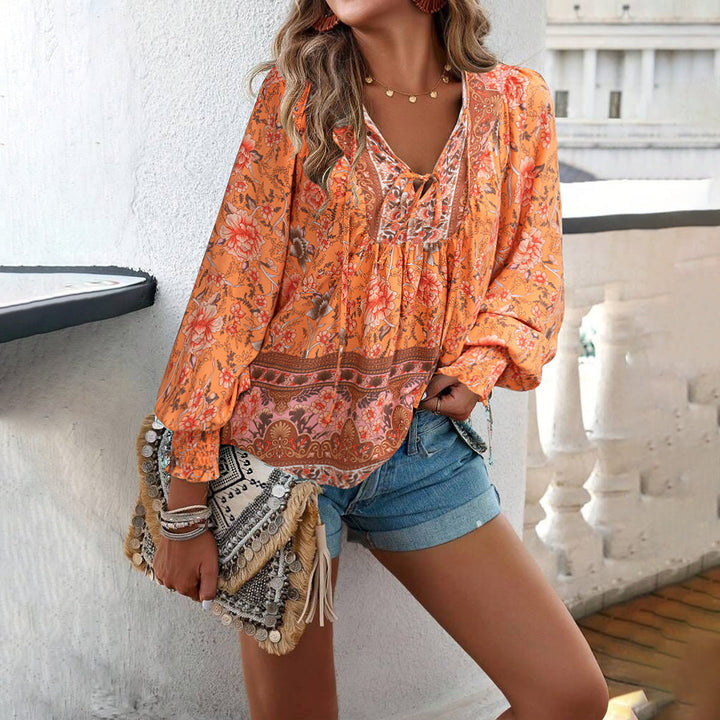 Lightweight women's floral long-sleeve top with tie front. Comfortable & stylish spring/summer blouse for everyday wear.