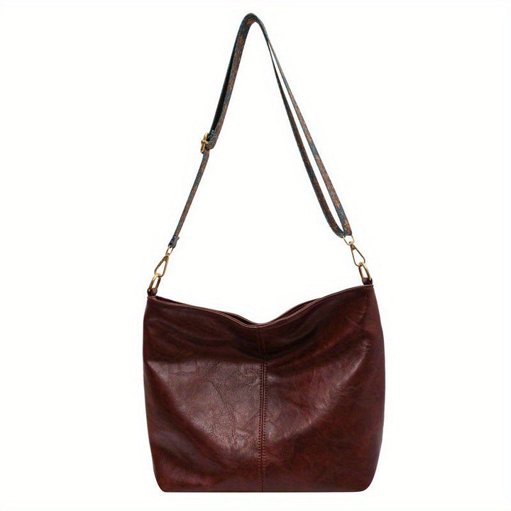 Classic genuine leather hobo shoulder bag for women. Stylish large capacity handbag, a timeless accessory.