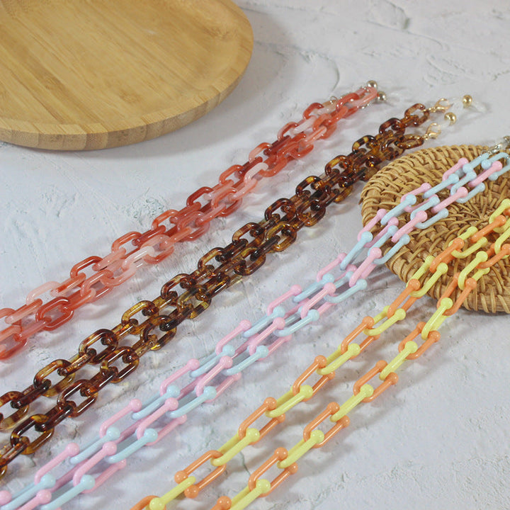 Elegant golden eyeglasses chain, a fashionable jewelry accessory to secure women's eyewear.