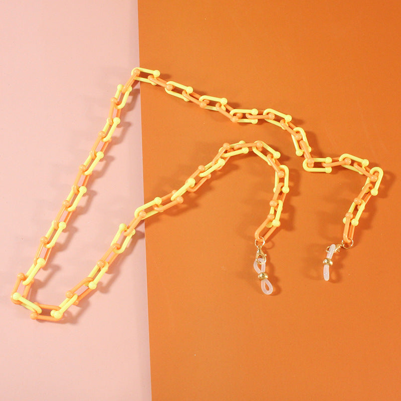 Gold-tone fashionable glasses chain, an elegant women's jewelry accessory for secure eyewear.