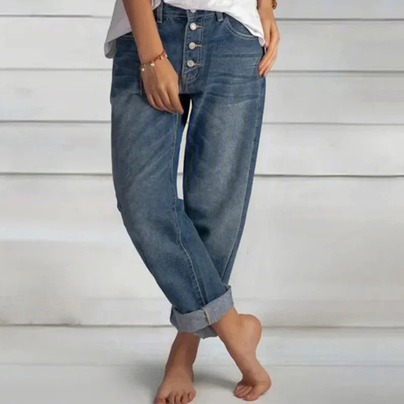 Stylish women's high-waist loose-fit blue denim jeans, perfect for casual wear and comfort.