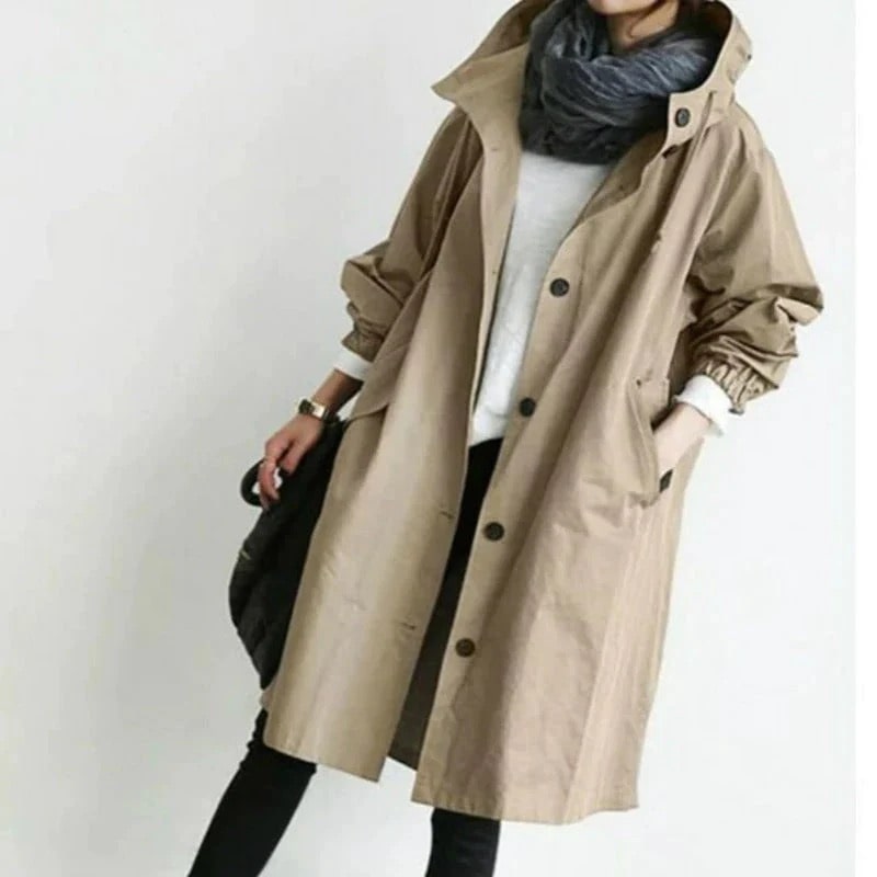 Versatile women's hooded long A-line rain coat, ideal for stylish outdoor wear & waterproof protection in any season.