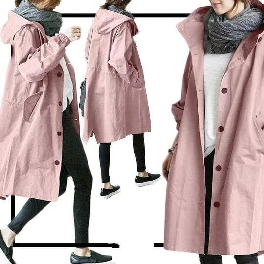 Woman modeling a stylish hooded A-line long rain jacket, showcasing its comfortable fit & fashionable silhouette.