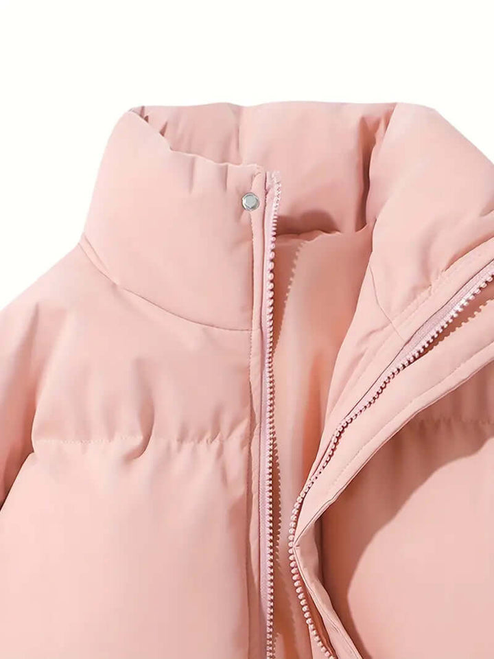 Black women's hooded puffer jacket. A stylish and warm winter coat, perfect for cold weather fashion.