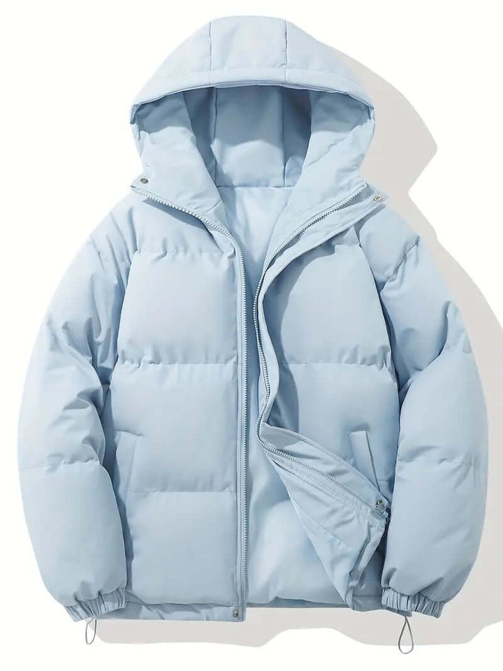 Woman wearing a stylish hooded puffer jacket. Warm winter outerwear, perfect for cold weather activities.