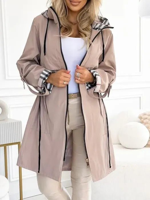 Women's weather-resistant, windproof & waterproof midi trench coat. Features a protective hood and full zip closure.