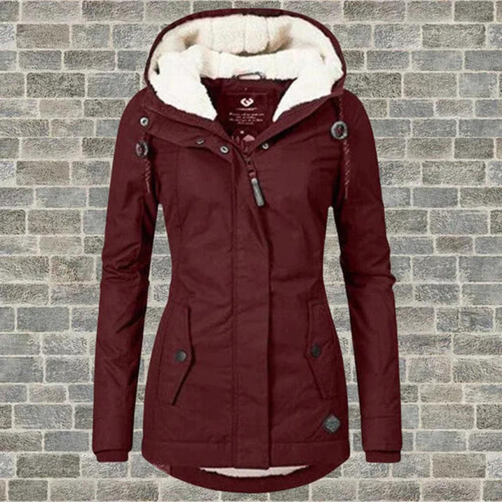 Versatile women's insulated hooded coat. Perfect for layering, providing warmth & style in cold fall weather.