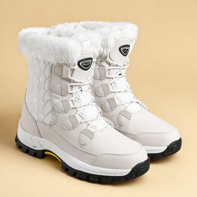 Stylish women's insulated snow boots for ultimate warmth & comfort in cold winter weather, featuring anti-slip sole.
